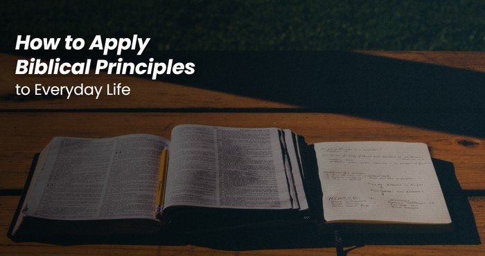 Person reading Bible at a desk applying biblical principles to everyday life decisions